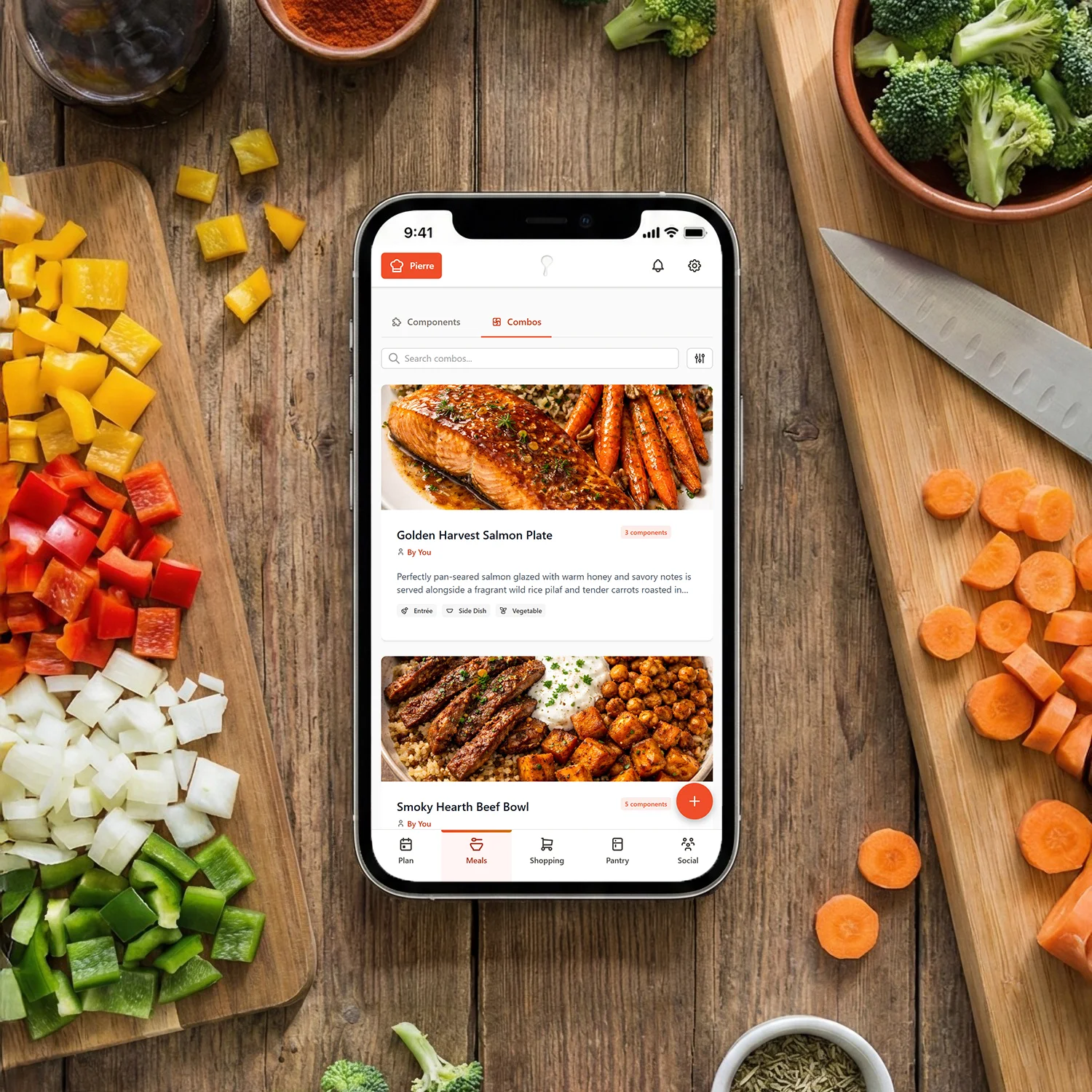 Smartphone displaying GoodSpoon meal planning app on kitchen countertop surrounded by fresh chopped vegetables and seasonings