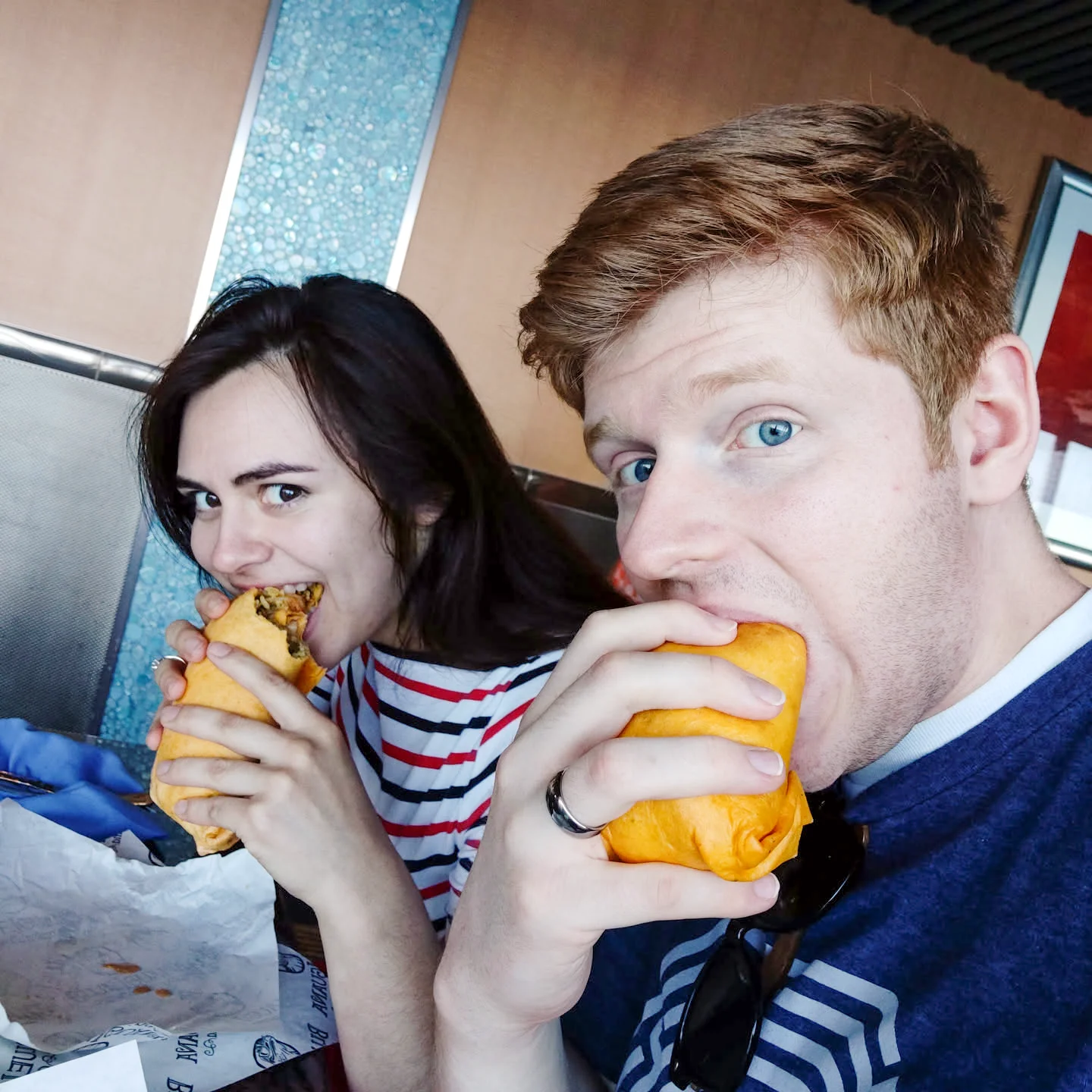 GoodSpoon founders enjoying burritos together, the couple whose meal planning challenges inspired the app
